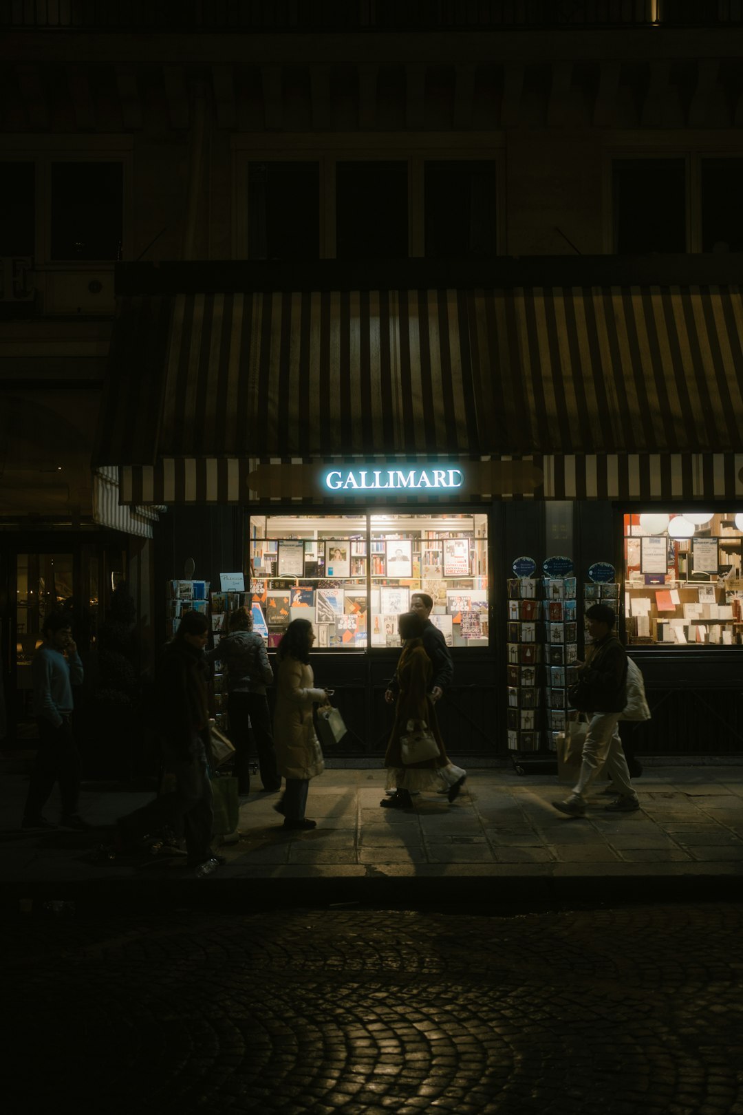 person reading book by window