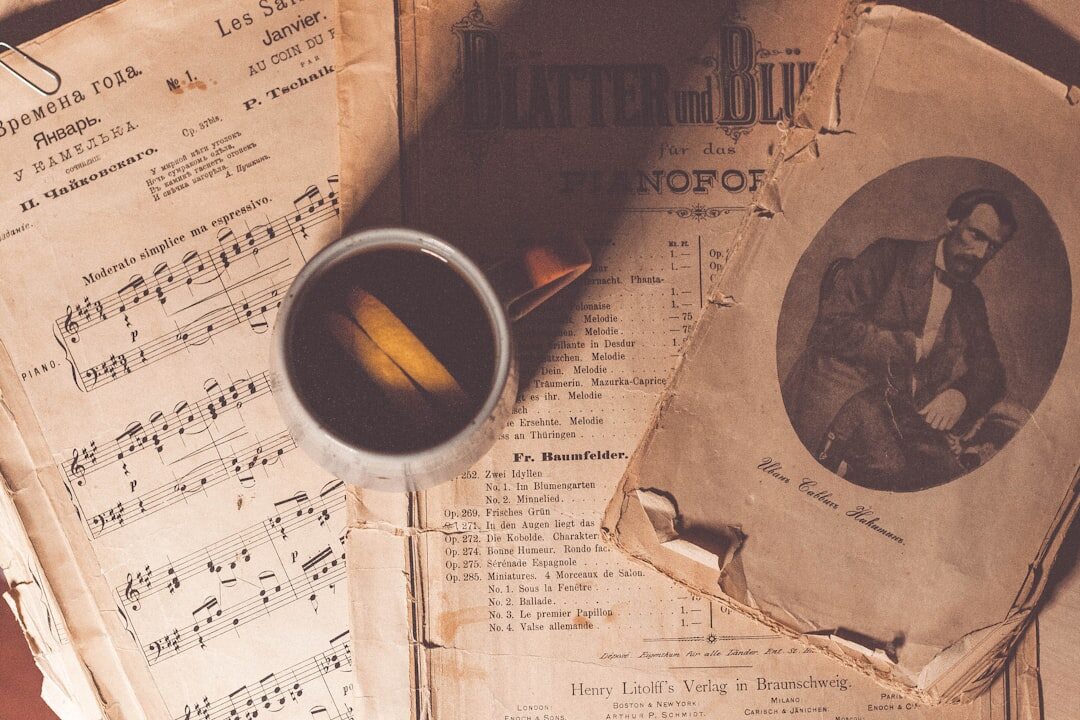 Vintage typewriter with a manuscript page and cup of coffee